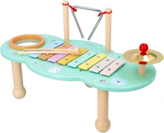 Mesa musical infantil con xilófono, triángulo y platillo