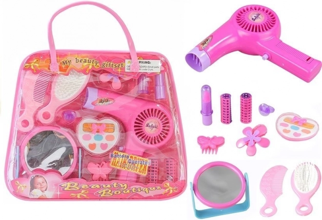 Juego de cosmética infantil en bolso con secador a pilas