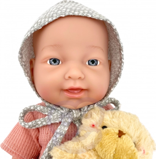 Extremidades móviles y chupete en la boca